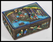 An early 20th Century Chinese silver plate on copper box having large relief decoration depicting