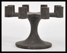 A vintage retro 1960's cast iron miniature candelabra designed and made by Robert Welch, raised on a