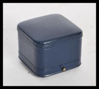 A vintage blue leather Boucheron ring box, the hinged box with Boucheron in gilt lettering
