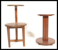 A 20th Century Art Deco mahogany circular occasional side table together with a walnut two tiered