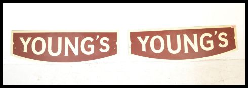 A pair of vintage retro 20th Century Advertising point of sale enamel sins for Youngs Beer in red