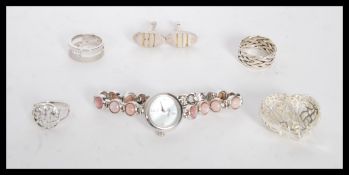 A selection of silver jewellery to include a stamped 925 heart pendant with pierced decoration, a