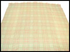 A vintage 20th Century Welsh woolen blanket, on a light blue ground with geometric patterns