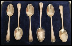 A set of five silver hallmarked Thomas Bradbury & Sons tea spoons set within a Walker & Hall box,