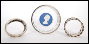 Two silver hallmarked napkin rings with repousse decoration (both hallmarked Birmingham 1907 & 1908,