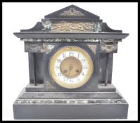 A 19th Century Victorian slate marble mantel clock raised on a large pedestal stepped base with gilt
