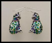 A pair of stamped 925 silver plique a jour earrings in the form of cats having ruby accent stones