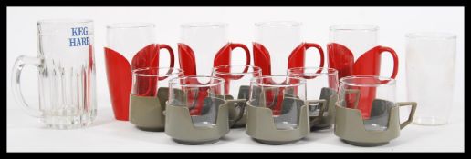 A retro 20th Century Pyrex coffee service, consisting of glass liners within red and grey plastic