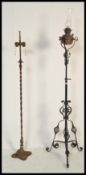 Two antique 19th / early 20th Century standard lamps to include a scrolled example and another
