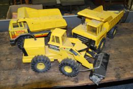 Three vintage yellow Tonka Truck toys to include a Tonka Turbo Diesel Toy Dump Truck, a Tonka dump