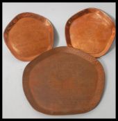 A set of three vintage early 20th Century pub advertising point of sale copper trays for Teachers