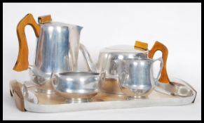 A vintage mid 20th Century Piquet Ware pewter coffee service, consisting of pots, creamer, sugar