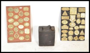 A collection of 20th Century brass horse brasses mounted onto board collected over several years