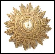 A vintage retro 20th Century Smiths sunburst / starburst wall clock having a central circular dial