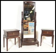 A Stag Minstrel mahogany pair of bedside cabinets together with a matching cheval mirror with single