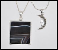 Two stamped 925 silver necklaces to include a snake chain having a square pendant set with grey