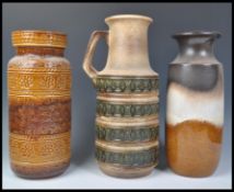 A group of three vintage retro 20th Century West German fat lava style pottery floor standing