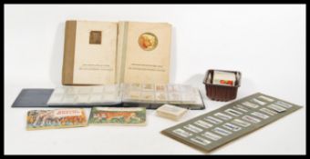 A collection of vintage cigarette cards to include a set of 50 Lambert & Butler Motor Cars, along