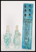 A 20th Century Egyptian revival scribes ceramic palette having a blue glaze inscribed with