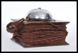 An early 20th Century 1920's Ever Ready oak cased servants bell, having chorded wire and battery