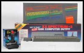 A vintage Sinclair ZX Spectrum +2 128k computer outfit games console in its original illustrated