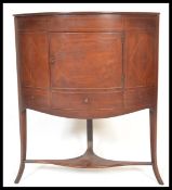 An early 19th Century Georgian mahogany corner cupboard washstand pot cupboard raised on sabre