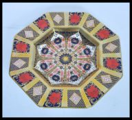 A Royal Crown Derby octagonal cabinet plate in the Old Imari Pattern decorated with gilt
