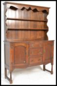 A 20th Century oak Welsh dresser, the plate rack with two fixed shelves, the base  having a