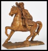 A vintage 20th Century gilt brass bronze effect figurine in the form of a 17th Century nobleman