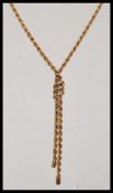 A hallmarked 9ct gold rope twist necklace chain having tasseled end and bolt ring clasp. Weights 3.2