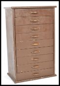 A vintage mid 20th century specimen cabinet / chest of drawers having a configuration of 9 drawers