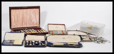 A collection of silver plate flatware to include a boxed Harrods fish set, a boxed lobster set, a