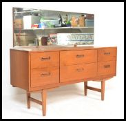 A vintage 1960's teak wood dressing table / sideboard having a configuration of six draws with