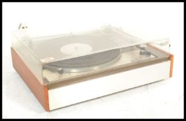 A vintage 20th Century Leak Lenco record player deck fitted within a brushed chrome and teak case.