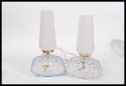 A pair of vintage retro 20th Century Metamec clock lamps having mother of pearl dials with signed