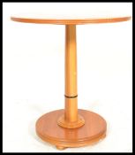A vintage retro 20th Century John Tanus round dining table, having a round teak wood top and base