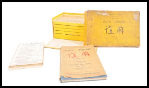An early 20th Century 1920's Chinese Mahjong set contained within original box with paperwork. The