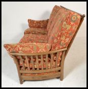 A 20th century Ercol Renaissance beech and elm wood three seater sofa / settee, the settee