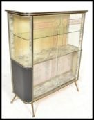 A stunning vintage mid 20th Century faux marble effect cocktail cabinet / bar, glass sliding doors