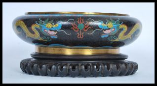 An early 20th Century circa 1920's Cloisonne Chinese bowl having an enamelled black ground with a