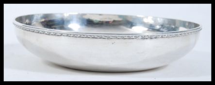 A silver hallmarked centrepiece bowl having moulded decoration to the rim. Hallmarked London 1935,