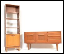 A vintage 20th century teak wood sideboard having a configuration of tree draws to the left and