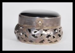 A 20th Century sterling silver 925 pill box of large bulbous form having pierced decoration with