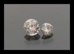 Two diamonds comprising of a 3.7mm x 2.5mm 20pts and a 10pnt 2.8mm x 1.8mm diamond stone.