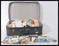 Old suitcase full of assorted ephemera items: paperwork, photos, publications - a diverse