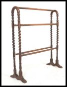 A 19th Century Victorian mahogany barley twist / bobbin turned towel rail with arched top.