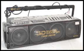 A vintage retro 20th Century Hitachi 3D Super Woofer Twin Drive boombox radio.
