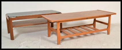 A vintage retro 20th Century teak coffee table having a smokey glass inset top along with another
