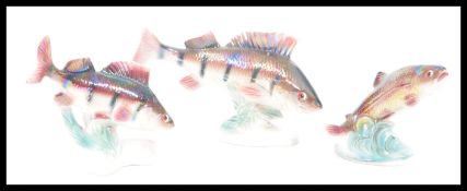 A group of three vintage retro 20th Century ceramic lustreware models of freshwater fish figures