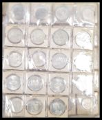 A collection of 20th Century Canadian coins to include silver dollar coins from the 50's and 60'